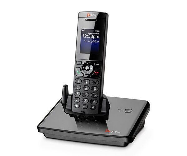 Black and silver phone on table representing an Office telephone system and PBX phone service for efficient business communication