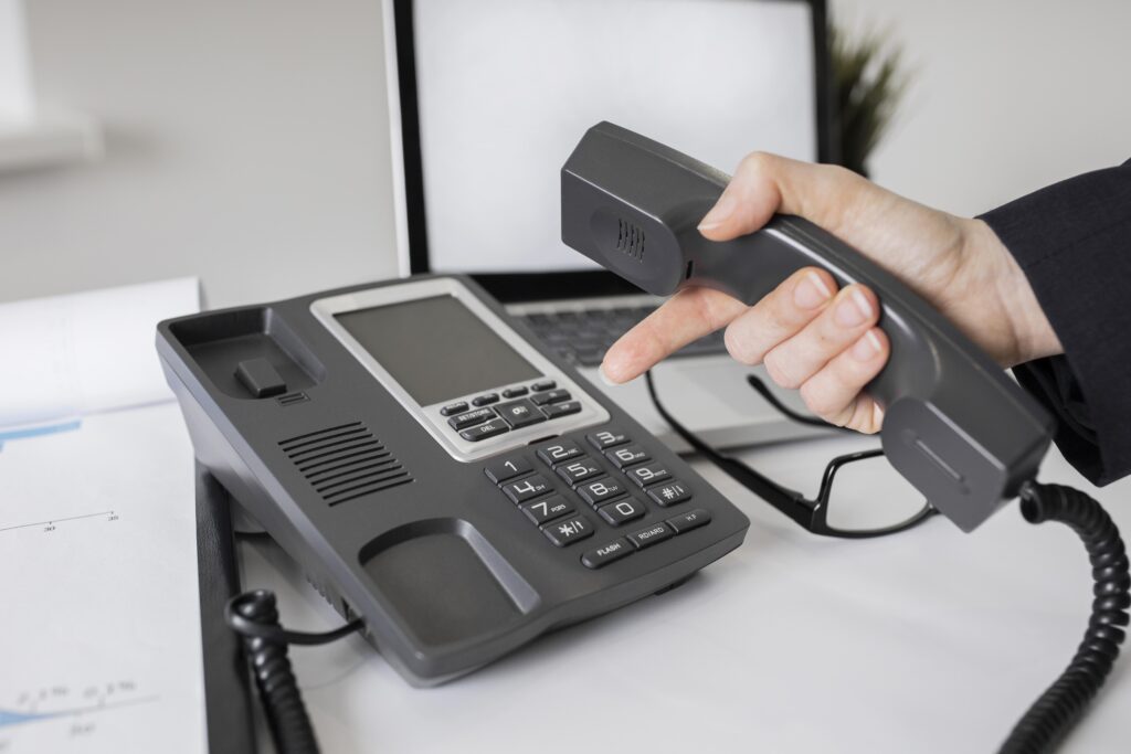 On-premise PBX hardware integrated with VoIP in a U.S. corporate office